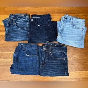5 pairs of men’s slim jeans. Sizes range from Youth 18 to Adult 30.